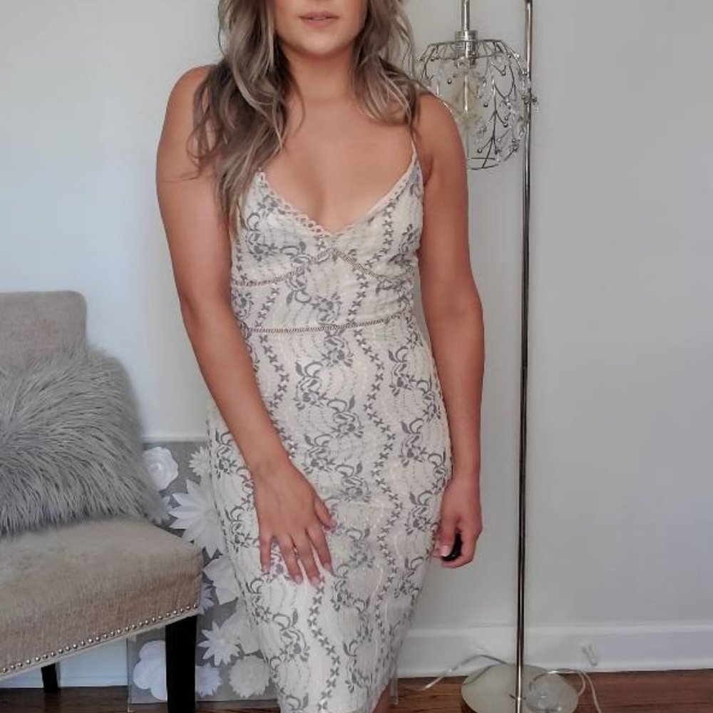 122. NWT Cream Lace Dress with Lavander Floral details